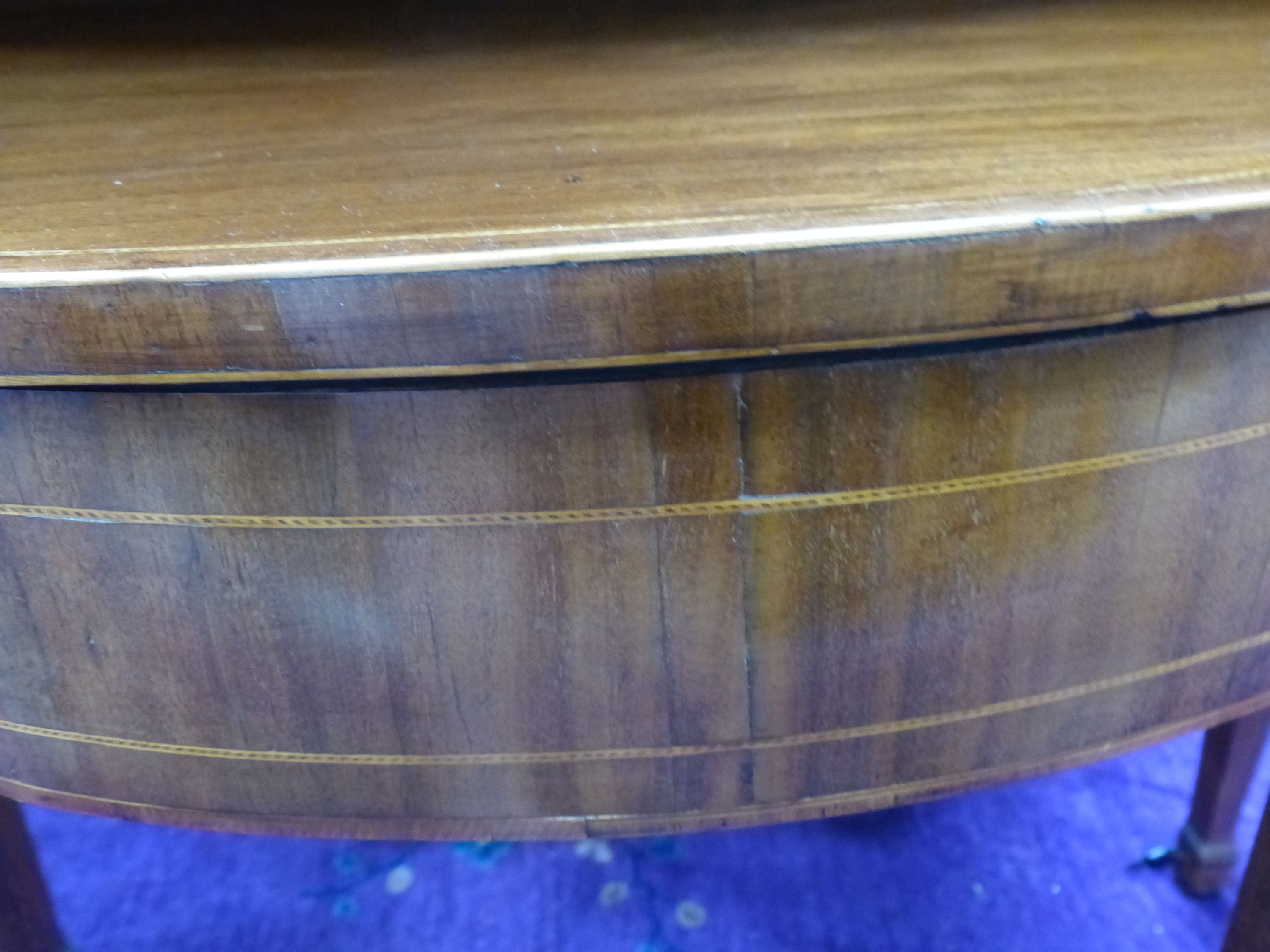 A George III inlaid demi lune folding tea table, width 93cm, depth 46cm, height 73cm